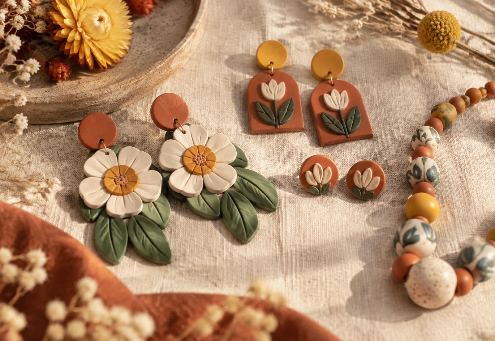 Colourful handmade earrings and necklace on linen